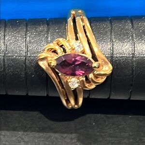 *Sculptural Gold Toned Ring with Purple Gemstone
